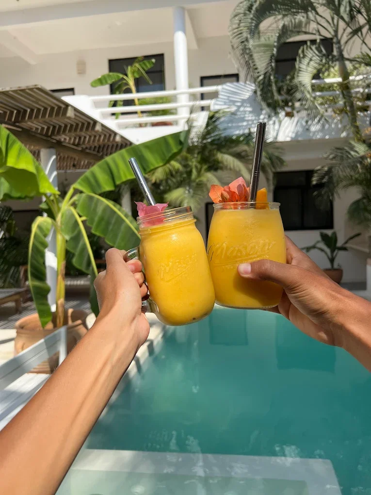 Sunshine smoothie cheers by the pool